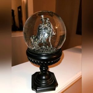 Skeleton couple dance on grave snow globe